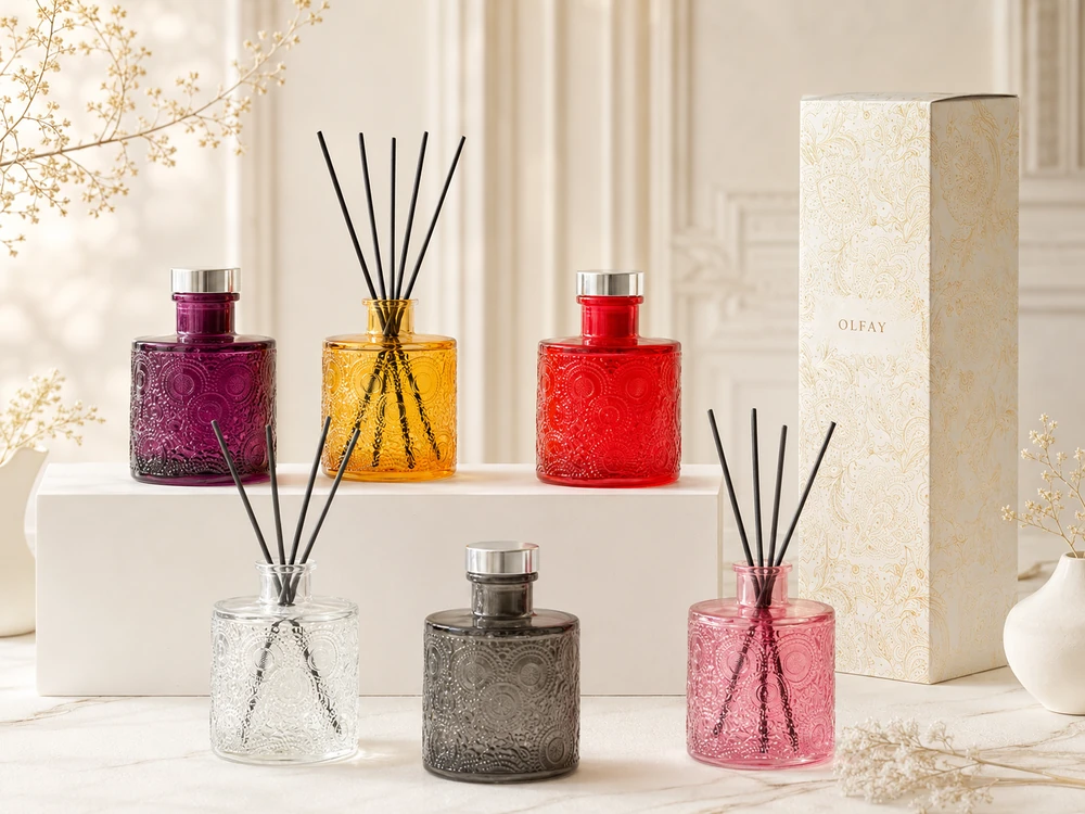 Wholesale 100ml embossed glass reed diffuser collection in six colors for private label home fragrance manufacturing