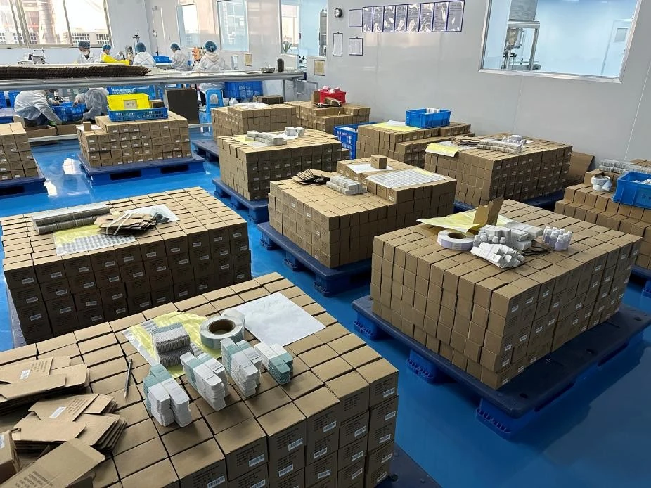 Packed fragrance cartons arranged in the factory storage area