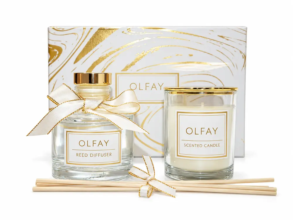 OLFAY white and gold candle and reed diffuser gift set in an open marble-pattern gift box